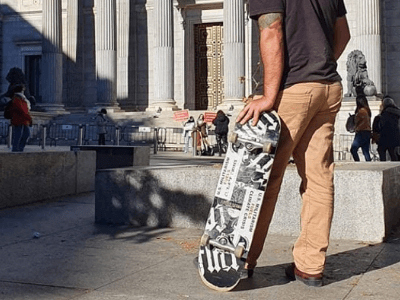 Image of Bumper sticker on back of skateboard