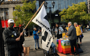 Image of member with VFP flag at event
